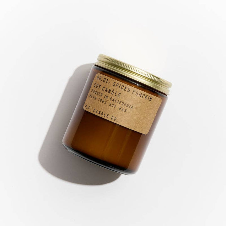 Spiced pumpkin candle with a label on a white background