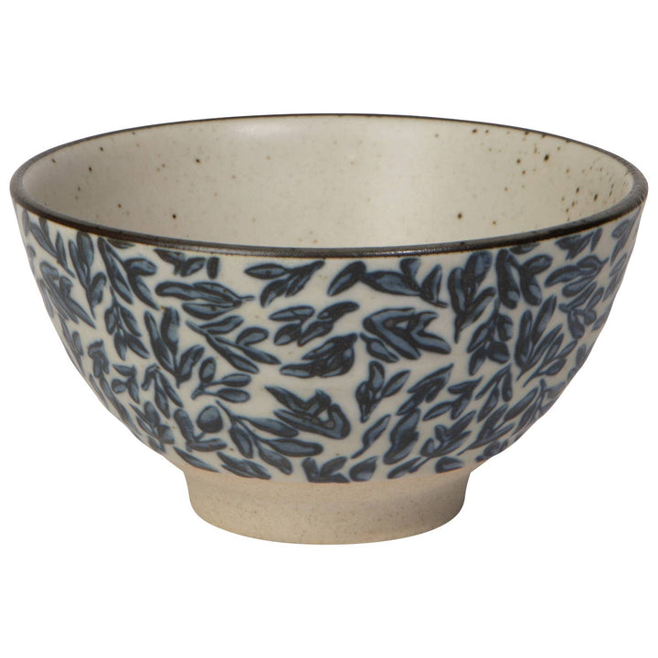 Ceramic bowl with blue leaf pattern on a white background