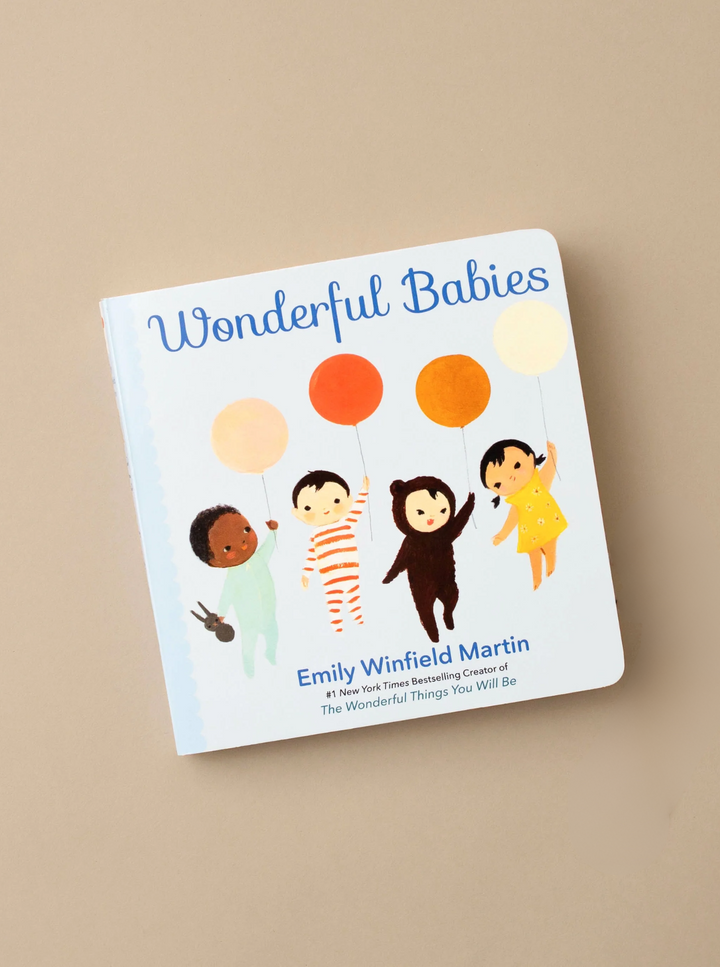 Book titled 'Wonderful Babies' by Emily Winfield Martin on a beige background
