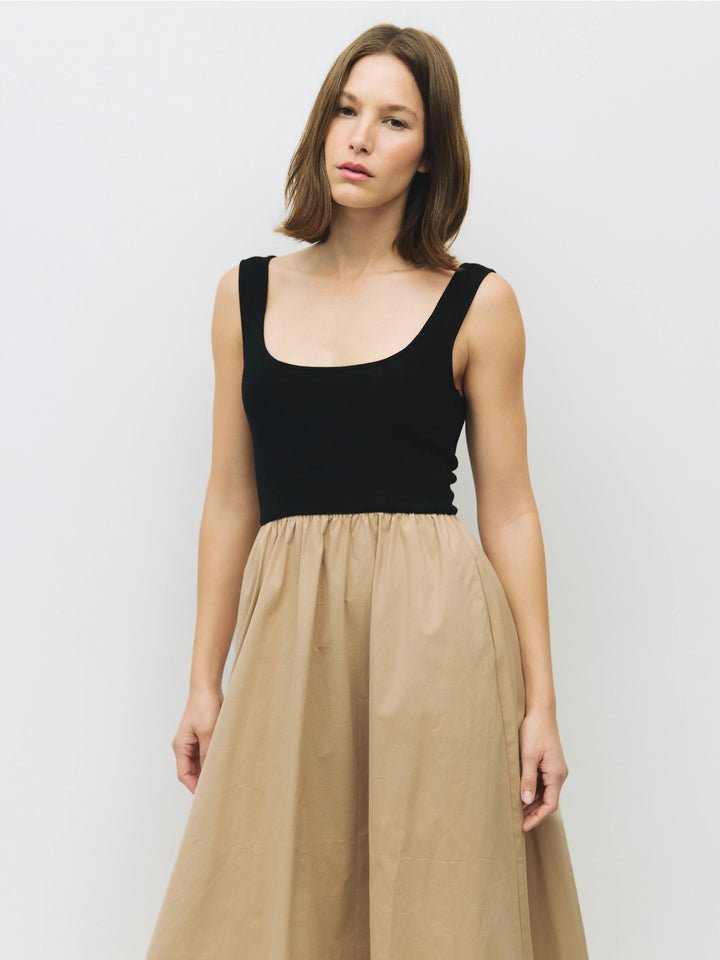 Woman wearing a black and beige cotton dress on a white background sold at shopwinsome.com a cute boutique based in chicago IL in the avondale neighborhood.