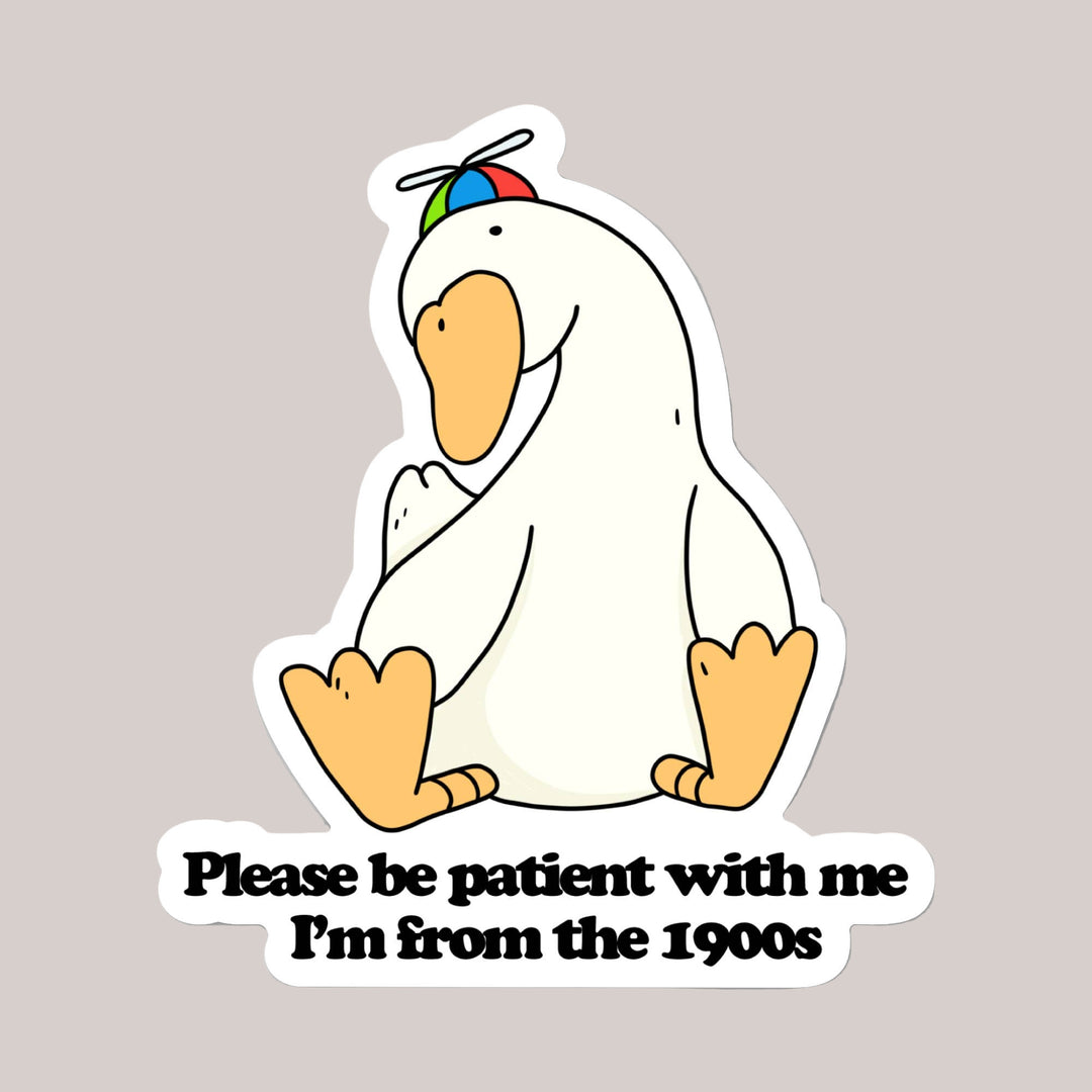 Cartoon duck wearing a helmet with text 'Please be patient with me I'm from the 1900s' on a white background