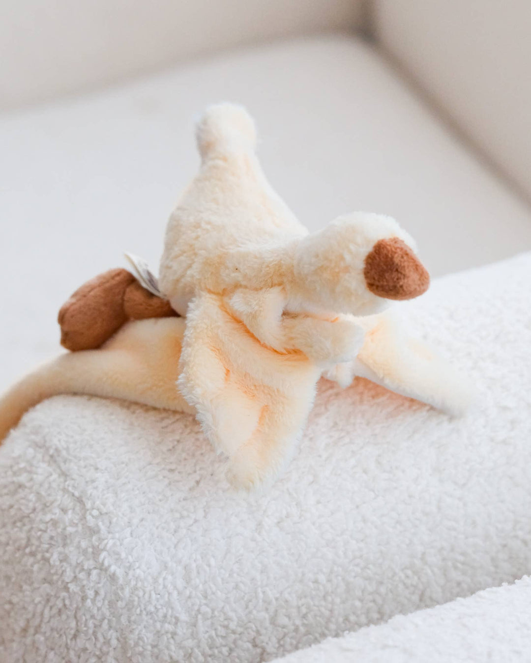 An ivory goose or duck lovey made from plush cotton for babies