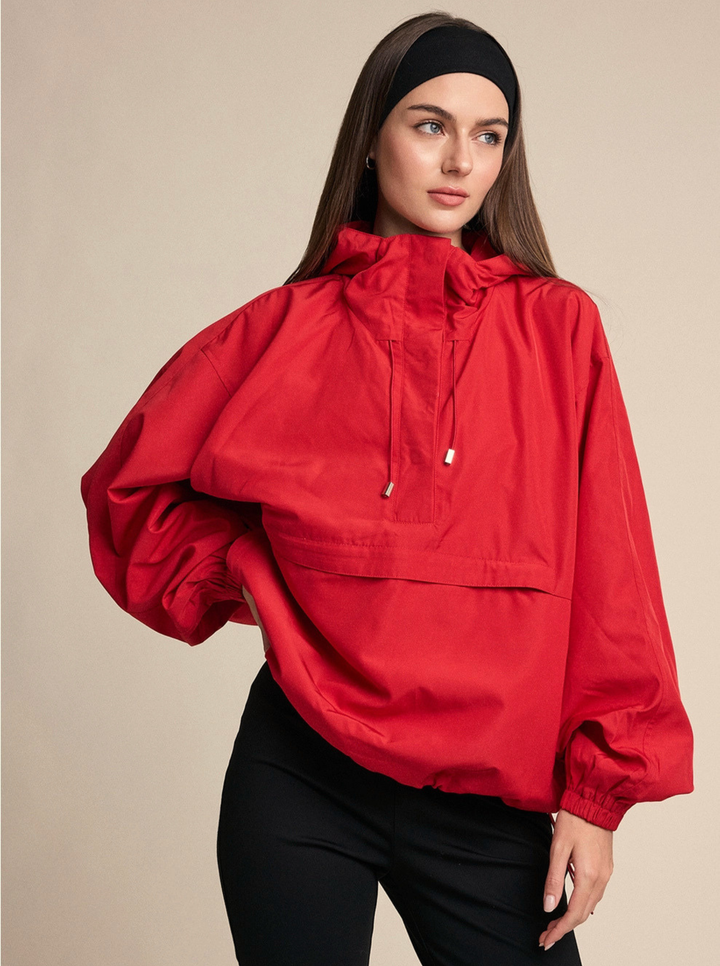 a bright red hooded anorak pullover jacket with drawstrings and front pocket
