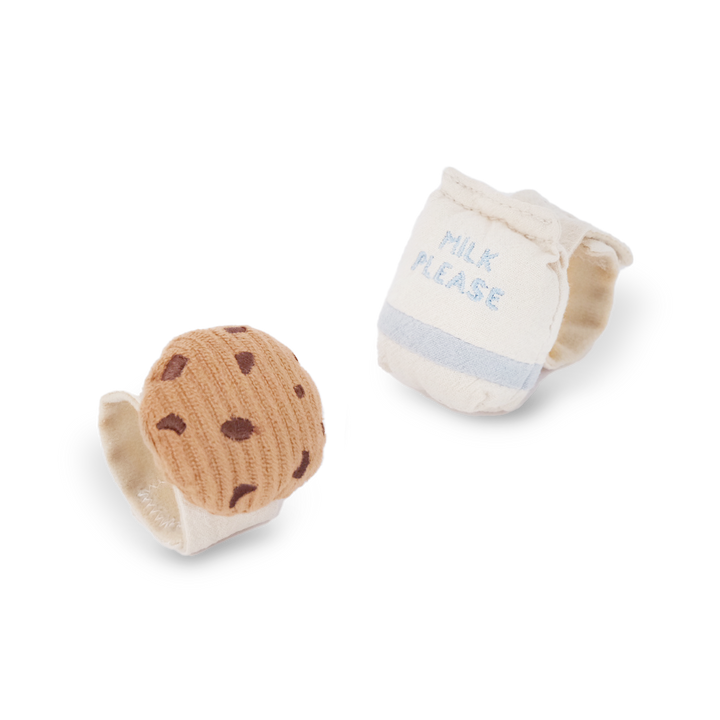 Two baby rattles: a cookie-shaped rattle and a milk carton with 'Milk Please' text on it a white background.
Winsome cute boutique chicago