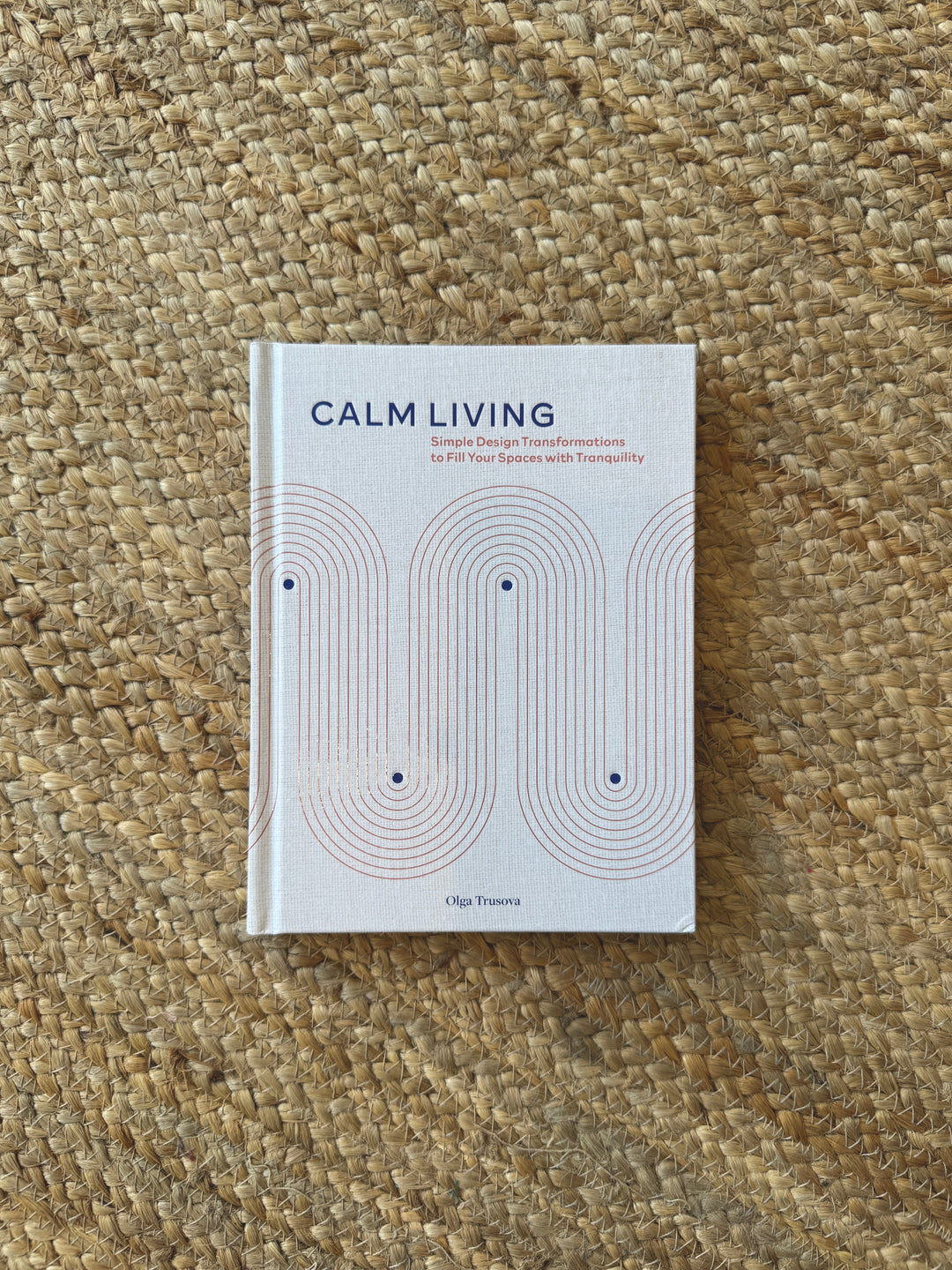 Book titled 'Calm Living' on a textured surface