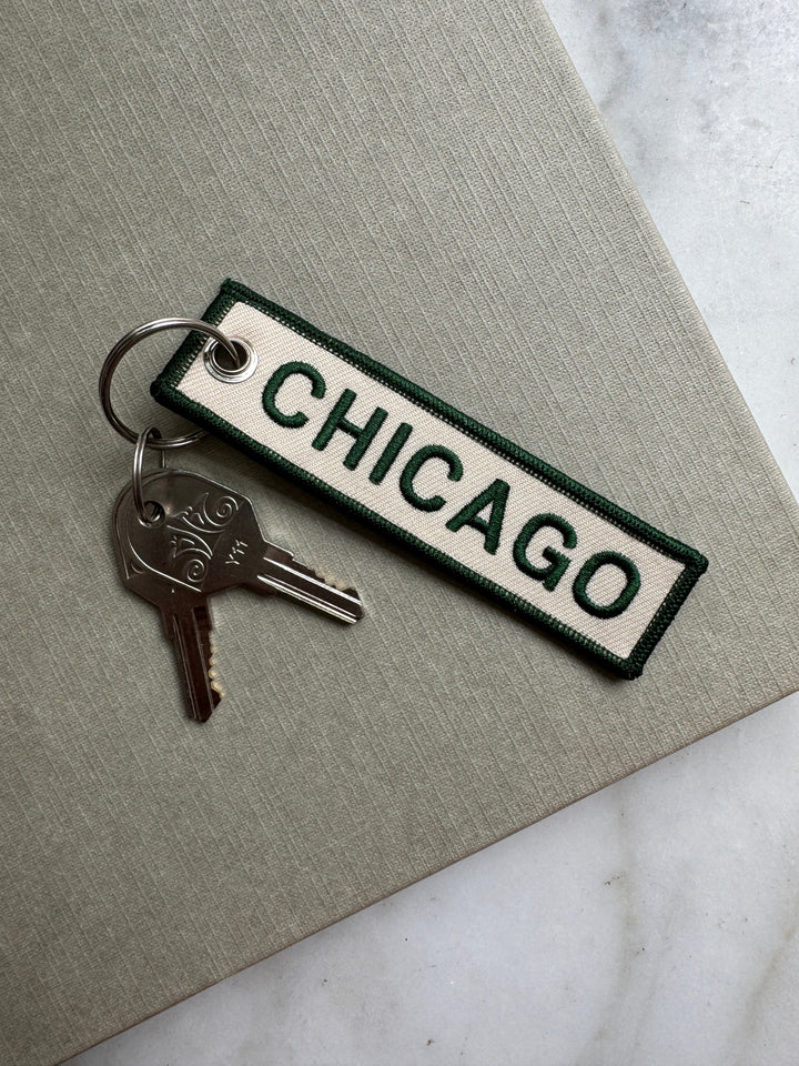 Keychain with 'Chicago' text on a gray surface