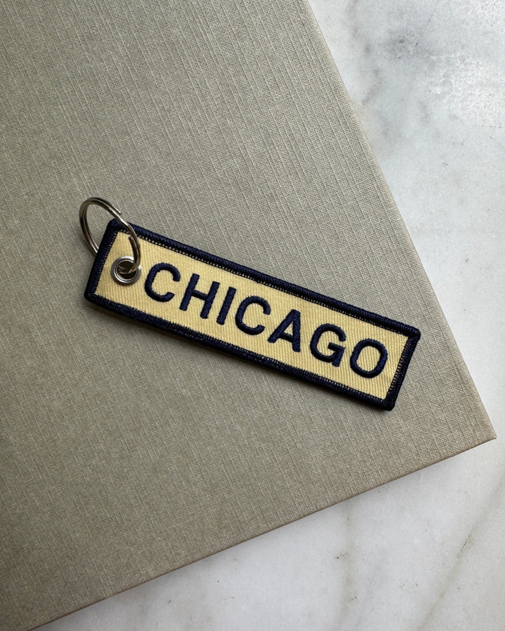 Keychain with 'Chicago' text on a textured surface